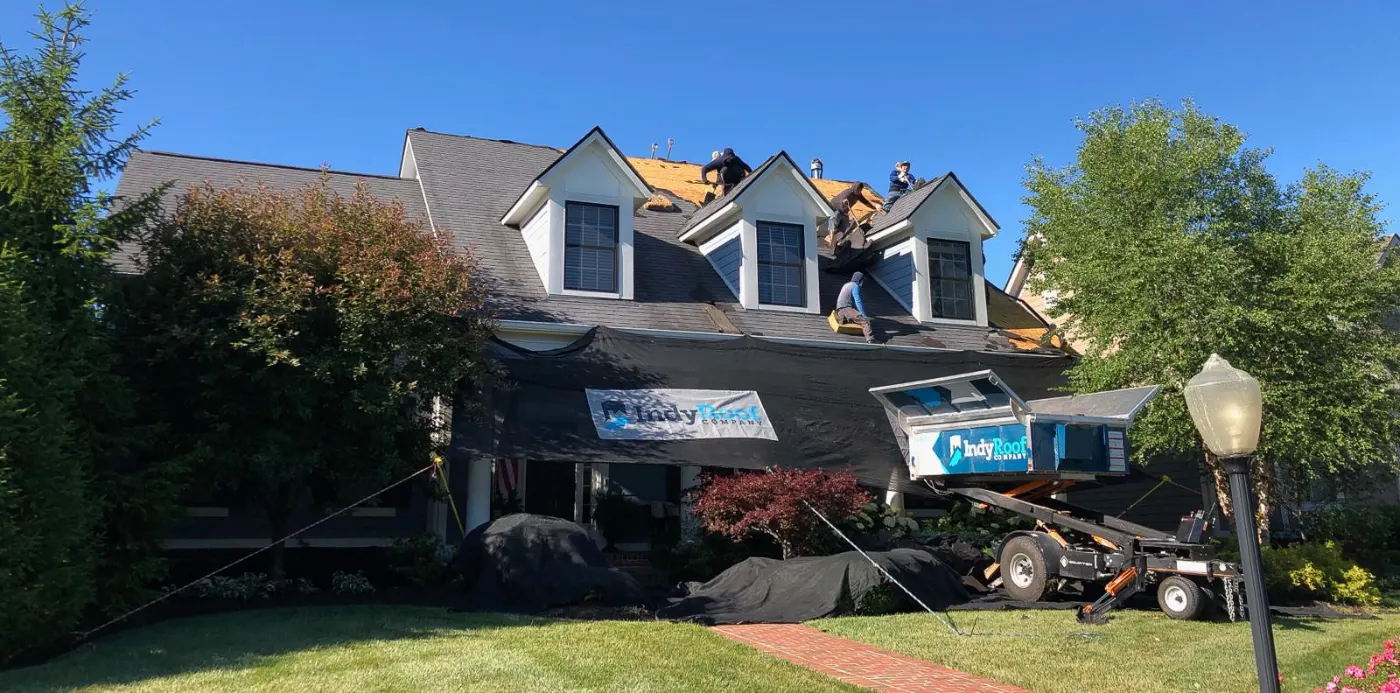 Tarping and dry-in on a Brookshire commercial roof
